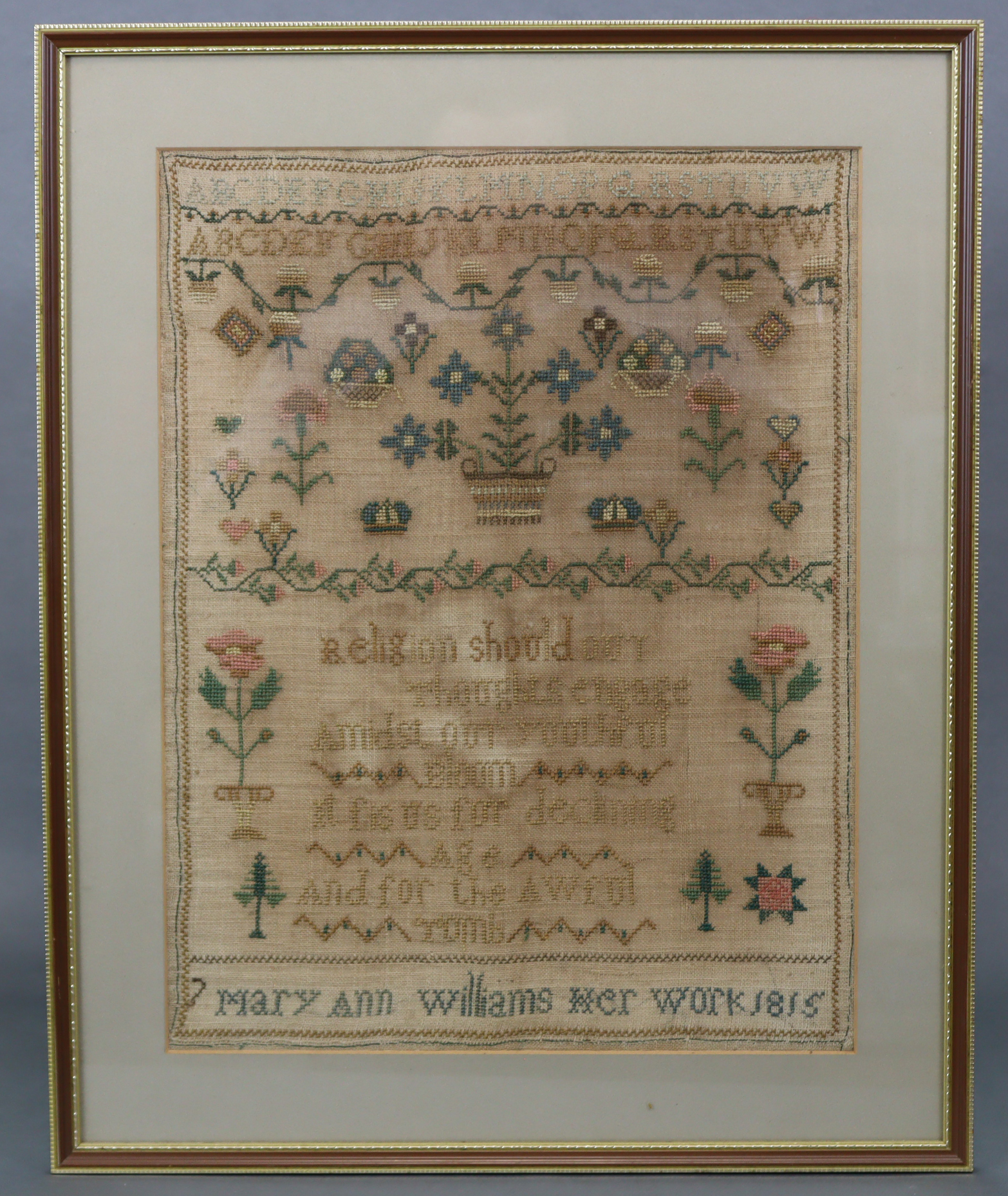 A George III silk needlework sampler inscribed “Mary Ann Williams, Her Work, 1815”, with alphabet,