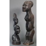 Two African carved hardwood tribal figures, one a double-headed bust on circular base, the other