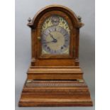 A late 19th century bracket clock with brass & silvered arch dial, subsidiary regulator dial,