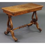 A Victorian figured walnut card table with moulded edge to the fold-over rectangular top inset green