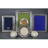 A pair of silver circular photograph frames, 2¾” diam.; another 3” diam., London 1919 by William