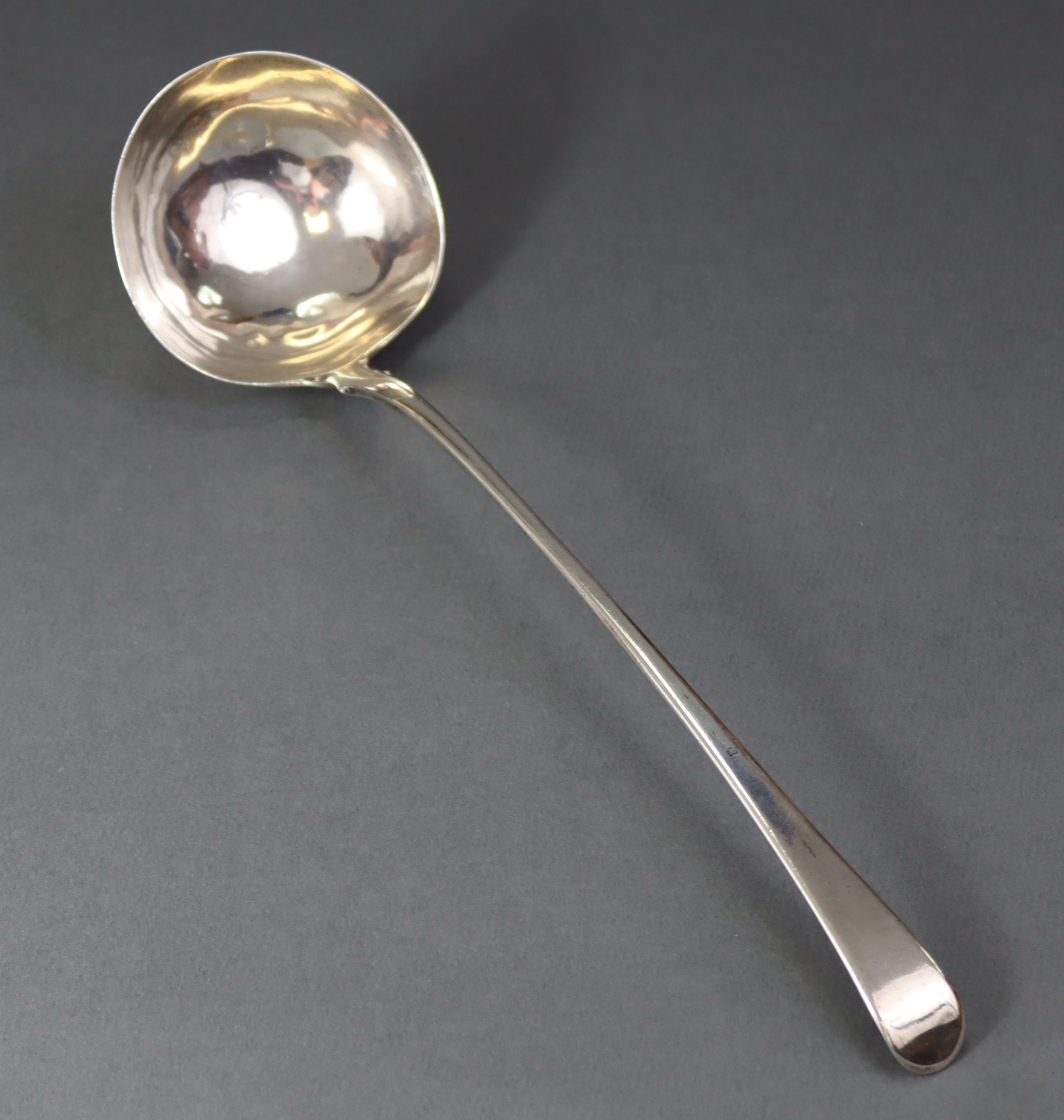 A George III silver Old English pattern soup ladle with plain round bowl, 13¼” long; London 1769, by