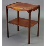 A George III-style flame mahogany two-tier side table, with raised moulded edge, shaped apron, &