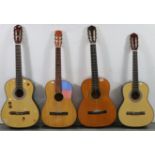 Four various six-string acoustic guitars.