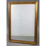 A large gilt frame rectangular wall mirror with beaded edge & inset bevelled plate, 43” x 31¼”.