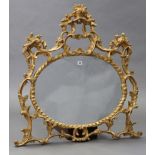 A 19th century-style gilt frame wall mirror with pierced scroll border & inset oval plate, 35¾” x