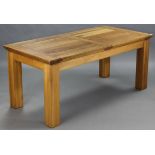 A LIGHT OAK RECTANGULAR EXTENDING DINING TABLE (purchased from T R Hayes of Bath), with centre leaf,