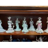 Seven Coalport bone china female figures.
