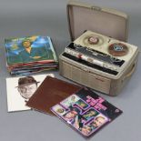 A Stellaphone portable reel-to-reel tape recorder; together with various L.P. records.