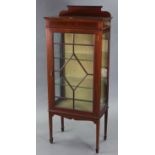 An Edwardian inlaid-mahogany small china display cabinet fitted two plate-glass shelves enclosed