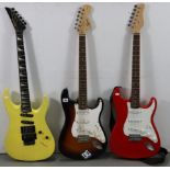 A Fender “Squire Strat” six-string electric guitar; together with two other electric guitars.