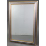 A large rectangular wall mirror inset bevelled plate, & in gilt & silvered-finish frame, 41” x