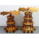 Two hand-made wooden candle-powered German Christmas carousel windmills, 25” & 21” high.