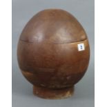 A hardwood milliner’s block of ovoid form, 12” high.