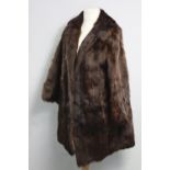 A rabbit fur silk-lined ladies’ coat.