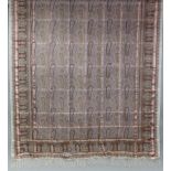 A KASHMIRI SILK LONG SHAWL, decorated with repeating rows of both to the central field, within