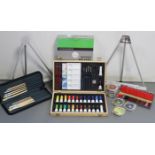 A Daler Rowney “Wooden Box Easel”, boxed; a Bridgeman & Green’s artists paint box; two other