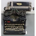 An early 20th century Royal typewriter; & a Hanimex reel-to-reel tape recorder.