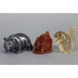 A coloured hardstone model of a standing bear, 1½” high; a glass model of a squirrel, 1¾” high; &