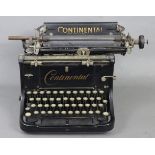 A 1930’s Continental of Queen Victoria Street, London typewriter, 17½” wide.