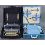 A Brexton picnic set in pale blue fibre-covered case; together with an Adler “Gabriele 35”