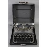 A Remington portable typewriter (model 5), with case.