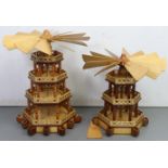 Two similar hand-made wooden candle-powered German Christmas carousel windmills, 24” & 19” high (one