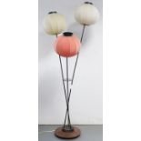 A contemporary standard lamp fitted with three lantern-shaped shades, & on a teak circular base, 61”