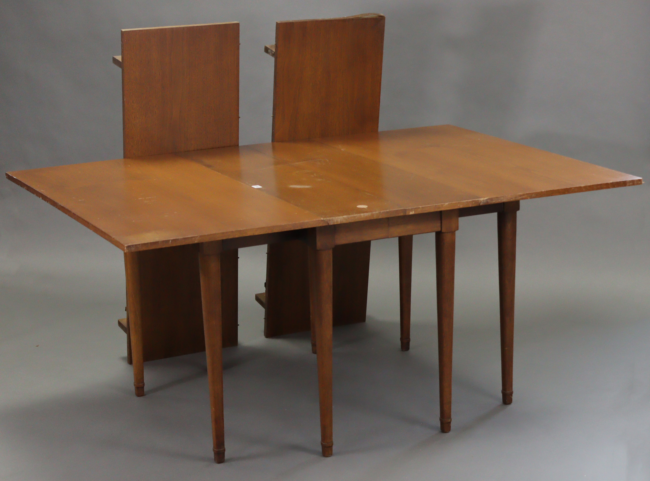 A hardwood drop-leaf dining table (with two additional leaves) on six square tapered legs, 46” x 96”