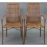 A pair of faux-bamboo bronzed-metal & rattan wicker conservatory chairs.