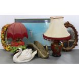 Two oval wall mirrors; two swan ornaments; two table lamps, each with shade; & a large coloured
