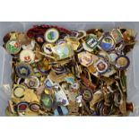 A collection of approximately three hundred various enamelled gilt-metal badges.