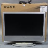 A Sony “Bravia” 23” LCD television with remote control, boxed, w.o.