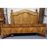 A continental-style hardwood “sleigh” bed with panelled head & footboard, 41½” wide, complete with