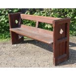 Another early 20th century pitch pine pew, with open back, hard seat, & panelled end supports,