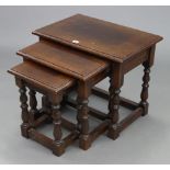 An oak nest of three rectangular occasional tables, each table on four baluster-turned legs with