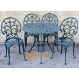 A green finish aluminium patio table with pierced circular top, & on three shaped legs, 32” diam.