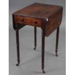 A 19th century inlaid-mahogany rectangular drop-leaf work table, on ring-turned legs with brass
