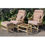 A pair of cane conservatory armchairs, each with loose cushion to the seat & back, & a ditto