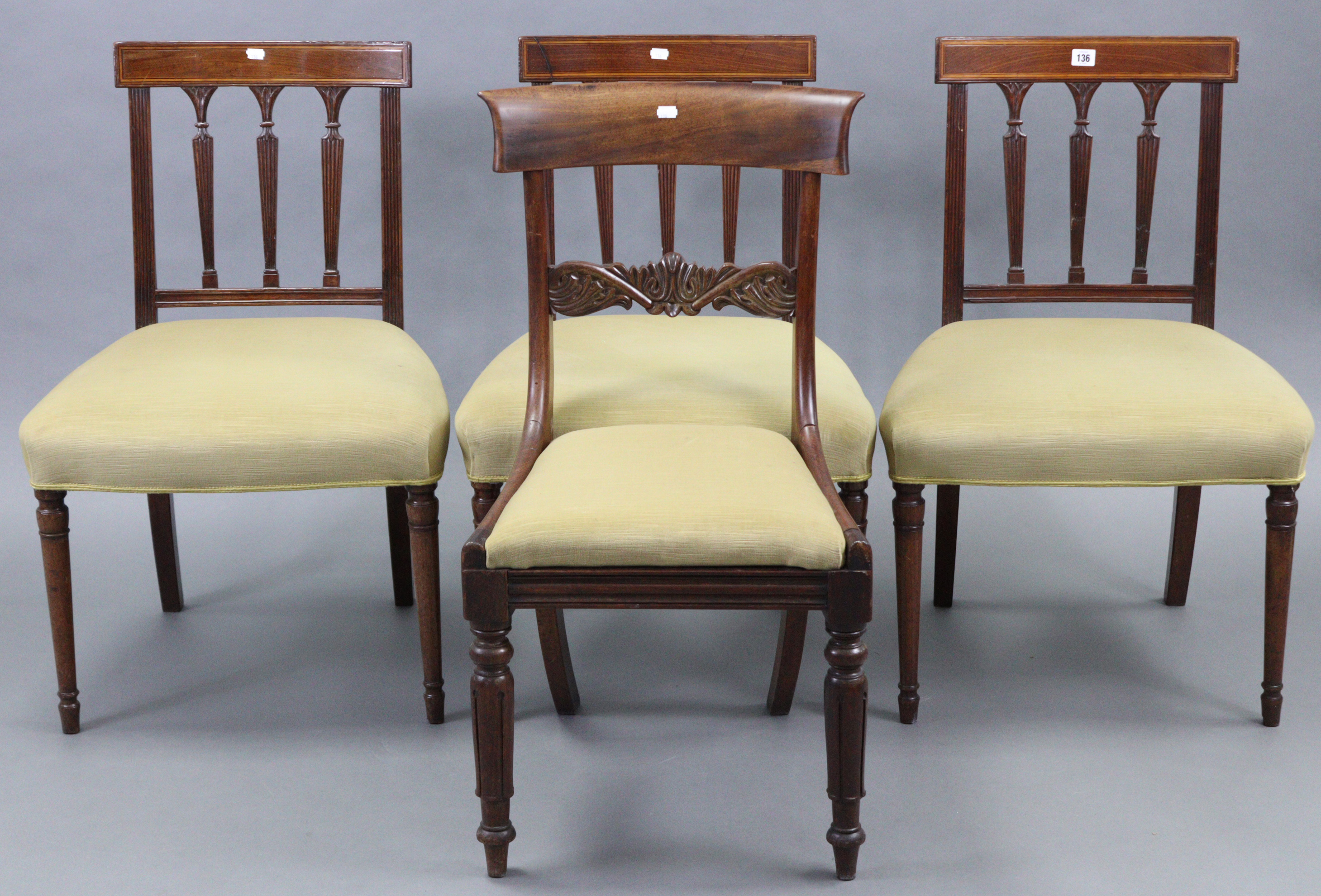 A set of three early 19th century inlaid-mahogany bow-back dining chairs with padded seats, & on