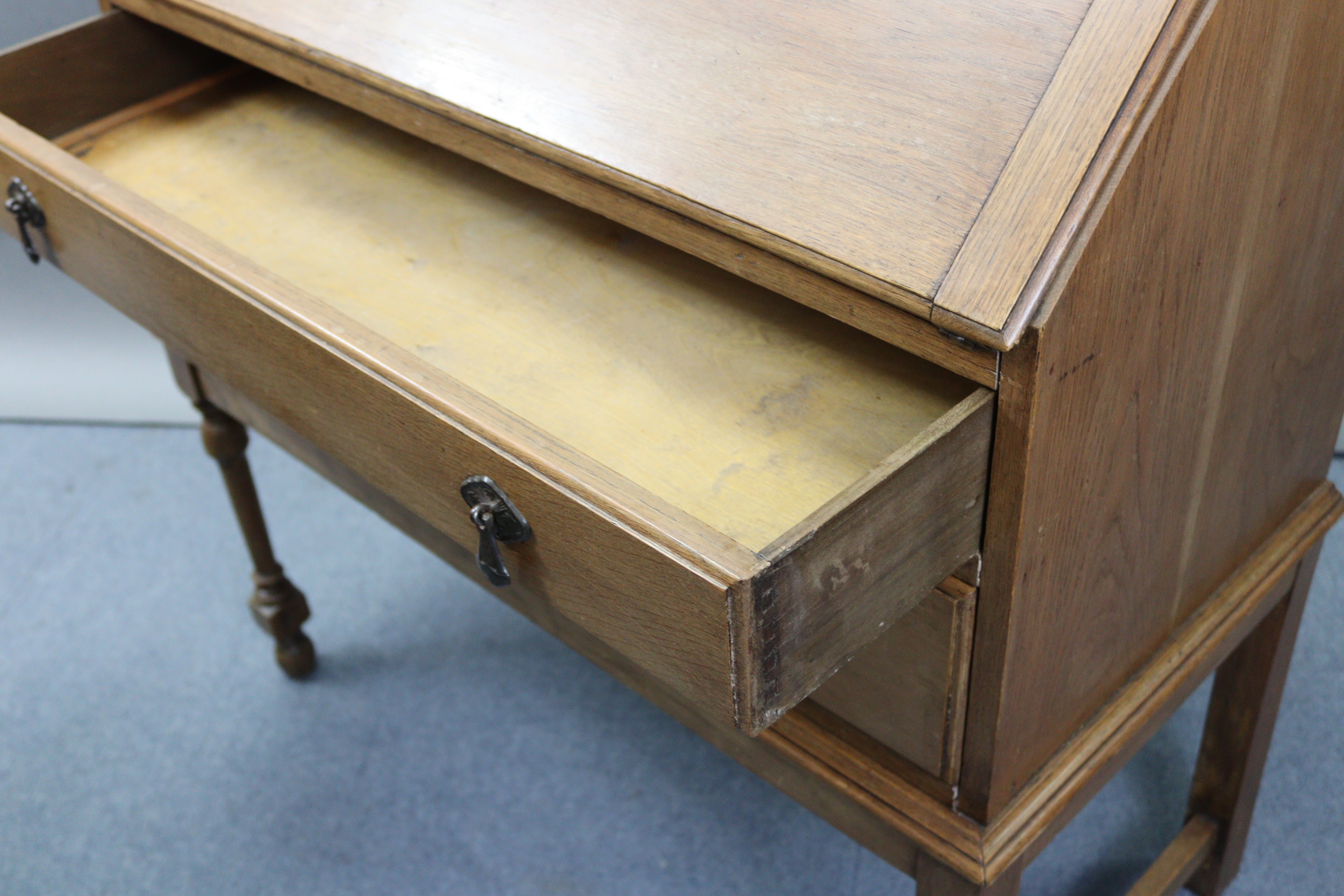 An early/mid-20th century oak bureau with fitted interior enclosed by fall-front above two long - Image 3 of 7