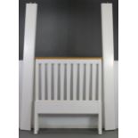 A natural & white finish pine single bedstead, complete with side rails.