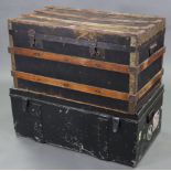 A fibre-covered ribbed wooden travelling trunk with hinged lift-lid & with wrought-iron side