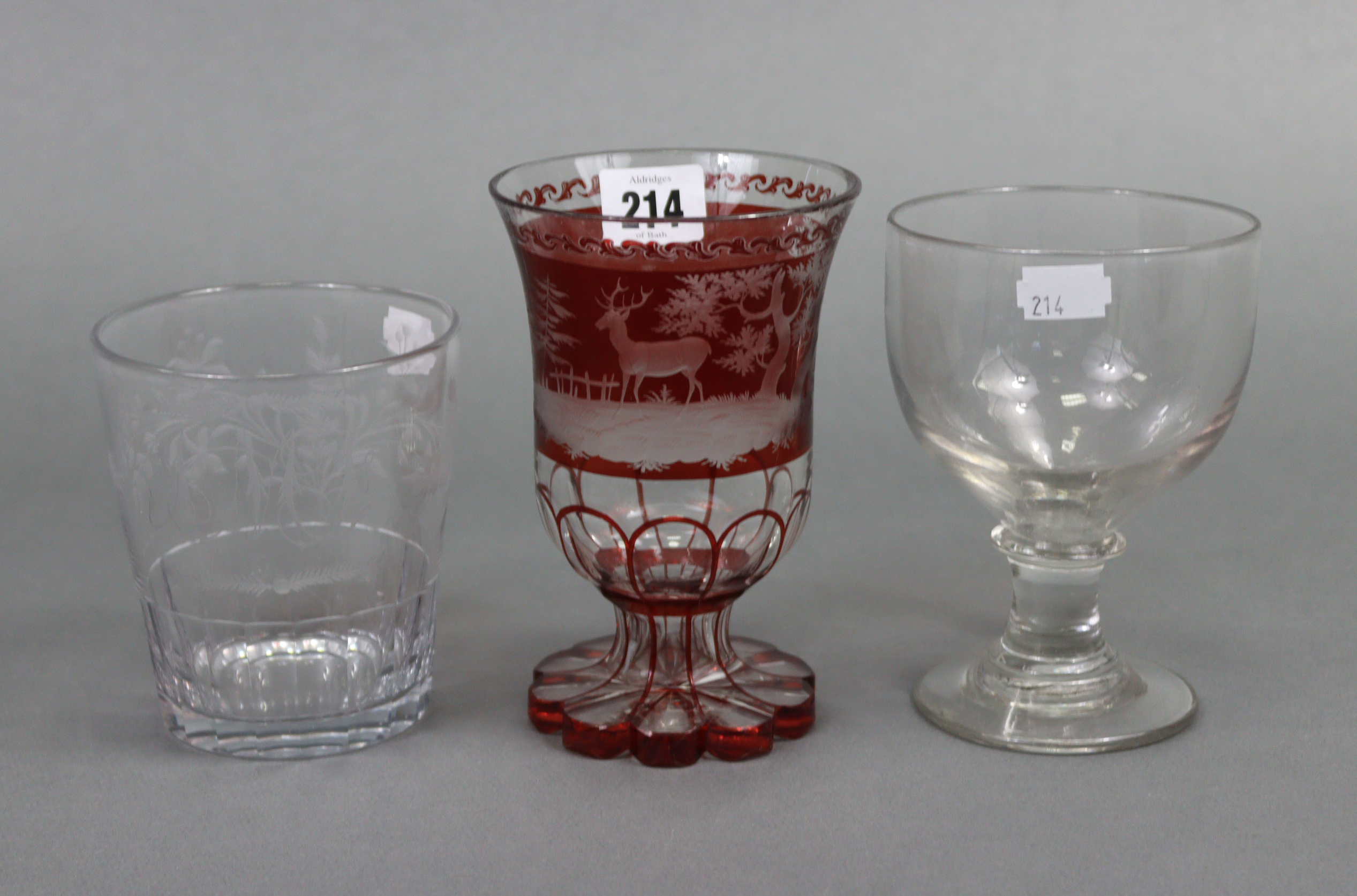 A ruby tinted & clear-glass vase with etched stag decoration, 16¼” high; a large glass tumbler