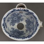 A late Victorian Conolly’s patent oval blue & white floral decorated w.c. pan, 17½” wide. w.a.f.