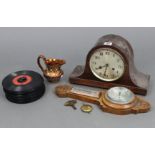 A 1930’s mantel clock with silvered dial, striking movement, & in an oak dome-top case, 8¾” high;