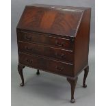 A mahogany bureau with fitted interior enclosed by fall-front above three long graduated