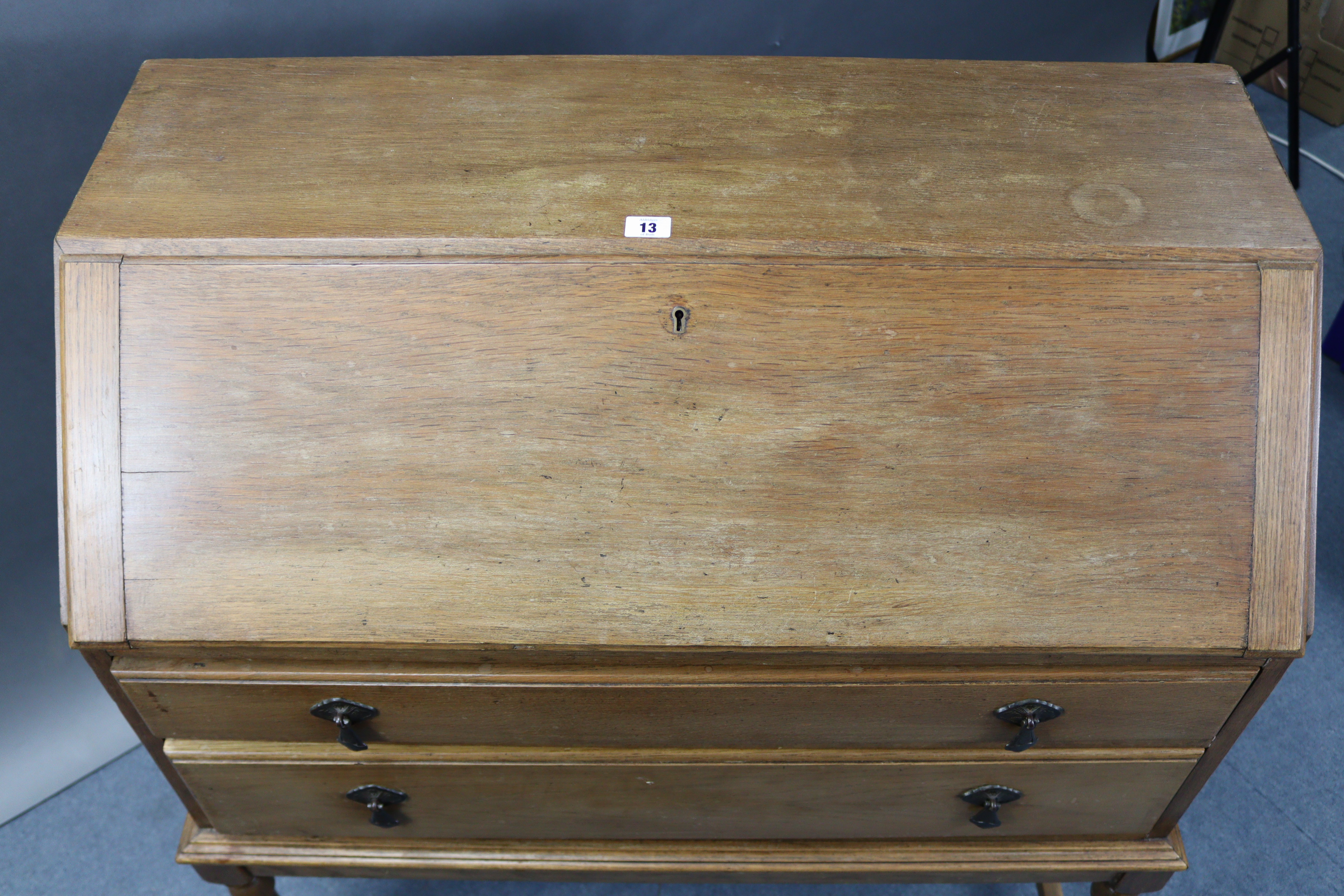 An early/mid-20th century oak bureau with fitted interior enclosed by fall-front above two long - Image 4 of 7