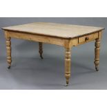 A Victorian pine kitchen table, with rounded corners to the rectangular top, fitted end drawer &