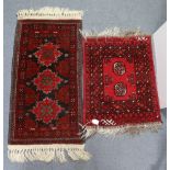 A small Afghan rug of deep blue & crimson ground, with central row of three lozenges in multiple